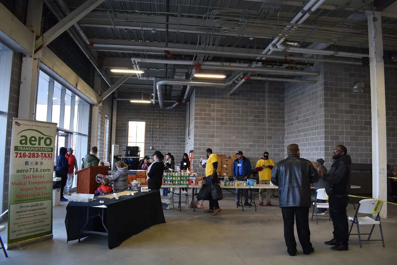 Volunteers organize food and event materials at a past Turkey Giveaway